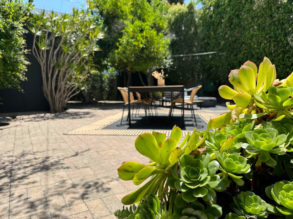 The patio and dining area seen from above through the trees